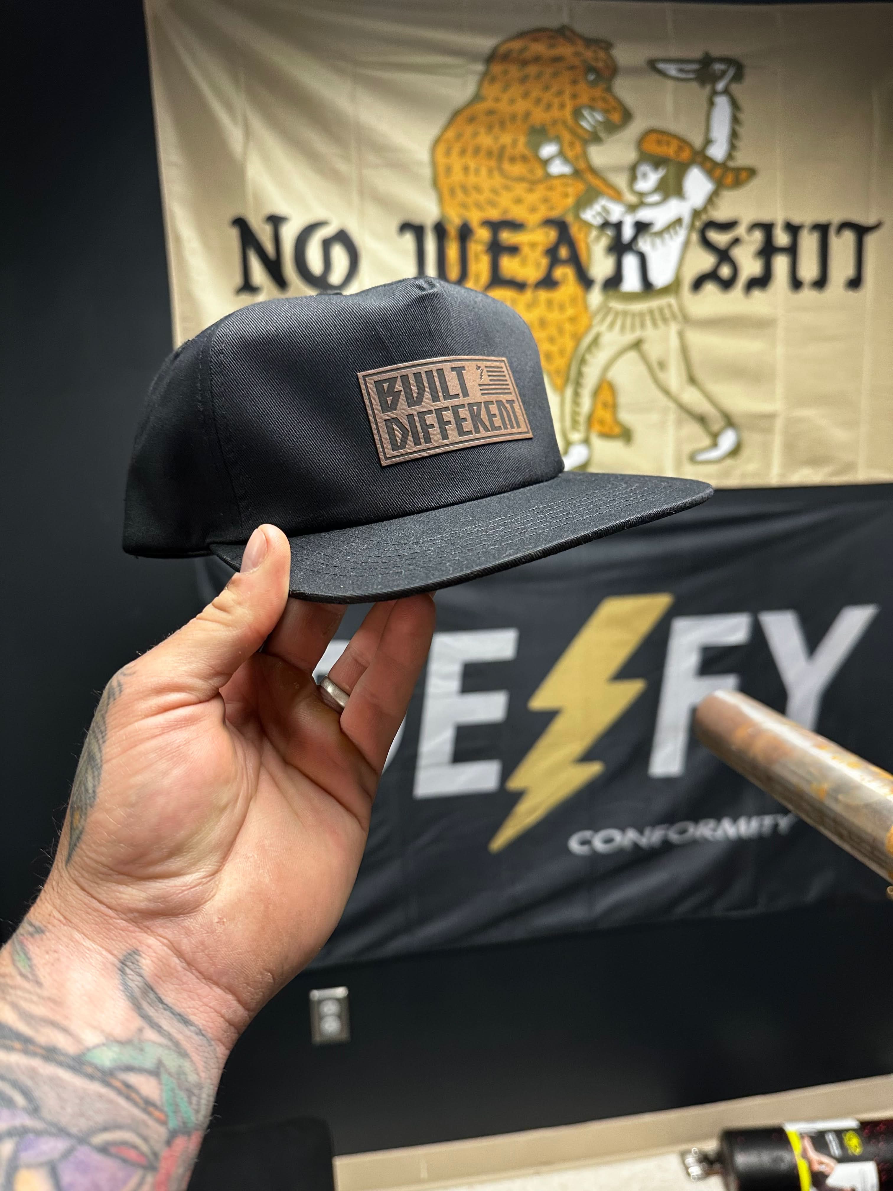 Built Different Patch Snapback Hat - We Defy The Norm